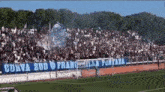 a soccer field with a banner that says " corva sud " on it