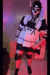 a person dressed in a maid outfit with a hello kitty hat