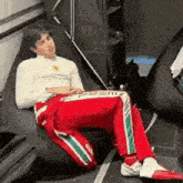 a man is sleeping on a bean bag chair .