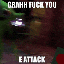 a green toy with the words grahh fuck you e attack