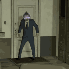 a man in a suit and tie is standing in front of a door with a purple helmet on his head