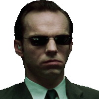 a man in a suit and tie is wearing sunglasses and ear buds