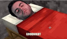 a man is laying in a bed with a red blanket and the words `` goodnight '' below him .