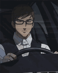 a man with glasses is sitting in a car with his hand on the steering wheel