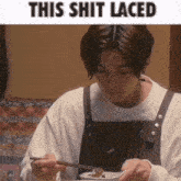 a man is eating a bowl of food with chopsticks with the caption this shit laced