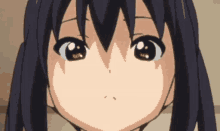 a close up of a cartoon girl 's face