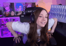 a woman wearing headphones with the letter m on them