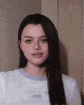 a woman wearing a white calvin klein new york city t-shirt