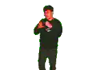 a man is standing in front of a microphone and singing into it .
