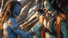 a movie poster for avatar shows a man shaking hands with a woman