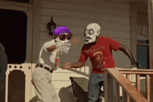 two men are standing on a porch wearing masks and sunglasses .