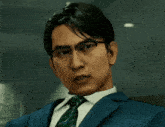 a man wearing glasses and a suit looks serious