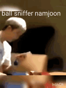 a blurred image of a person with the words ball sniffer namjoon written on it