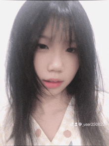 a close up of a girl 's face with user250822 written on the bottom right