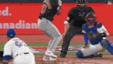 a baseball player with the number 10 on his jersey is swinging at a ball
