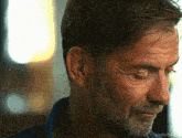 a close up of a man 's face with the words millythegirl.com visible in the corner