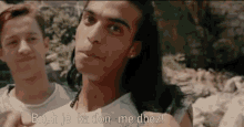 a man with long hair is standing next to another man and says bitch je ka don me dhez