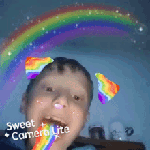 a boy with a rainbow in his mouth and the words sweet camera lite on the bottom right