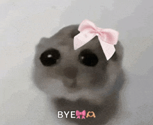 a hamster with a pink bow on its head and the word bye written below it