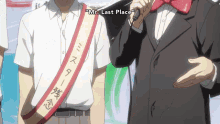a man with a sash that says " mr. last place " on it