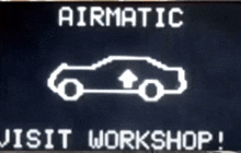 a sign that says airmatic visit workshop with a car on it