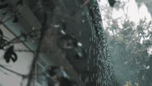 a building with rain drops falling on it