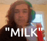 a blurry picture of a woman with the words " milk " on the bottom right
