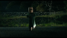 a person is flying through the air in front of a car .