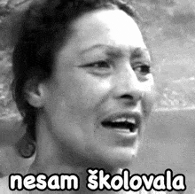 a black and white photo of a woman with a caption that says nesam skolovala