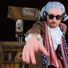 a man in a patriotic costume is pointing at something