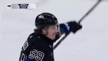 a hockey player wearing a jersey that says bertuzzi on it