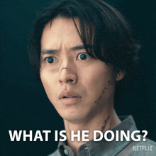 a man with a scar on his face is being asked what is he doing