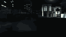 a dark city street with a building that says ' eastern ' on it