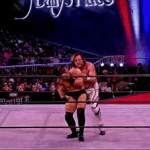 Kenny Omega Belly To Back Suplex GIF