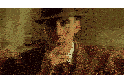 a man in a suit and hat is smoking a cigar