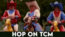 three men dressed as cowboys are riding horses in a parade .