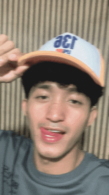 a young man wearing a hat that says aer on it