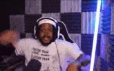 a man wearing a shirt that says faster than light