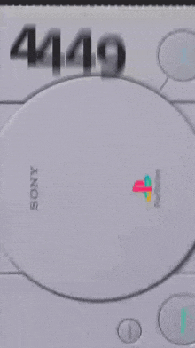 a close up of a video game console with a playstation logo on the screen .