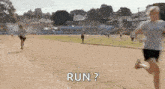 a group of people are running on a track and one of them is asking the other to run .