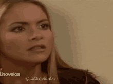 a close up of a woman 's face with the hashtag lialmeida05 on the bottom