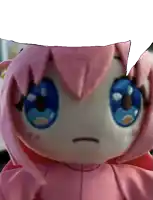 a pink and white stuffed animal with blue eyes and a speech bubble
