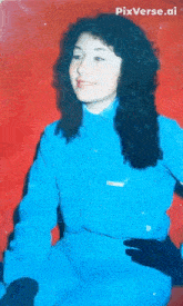 a woman in a blue shirt has pixverse.ai written on the bottom