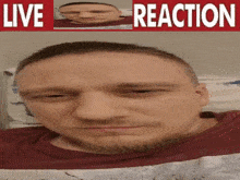 a man with a beard is laying in bed with the words live reaction above him