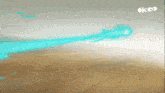 a cartoon drawing of a blue beam coming out of the sky with the letters okoo on the bottom right