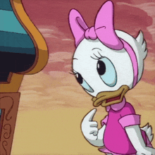a cartoon character with a pink bow on her head