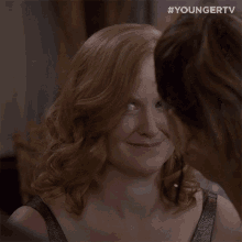 a close up of a woman 's face with the hashtag #youngertv on the bottom