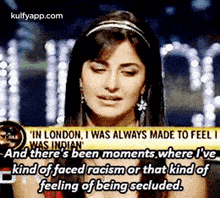a woman with a headband on her head is talking about racism in london