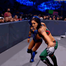 two women wrestling in a ring with the hashtag #thenextbig thing on the bottom right