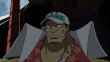 a man wearing a white hat with the word marine on it